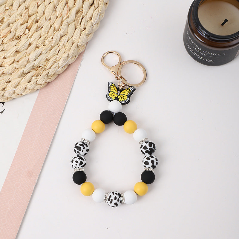 Wholesale Rubber Tassel Silicone Wood Water Keychain